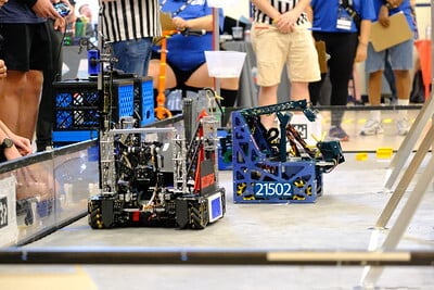 FTC robots competing on the field at Cowtown